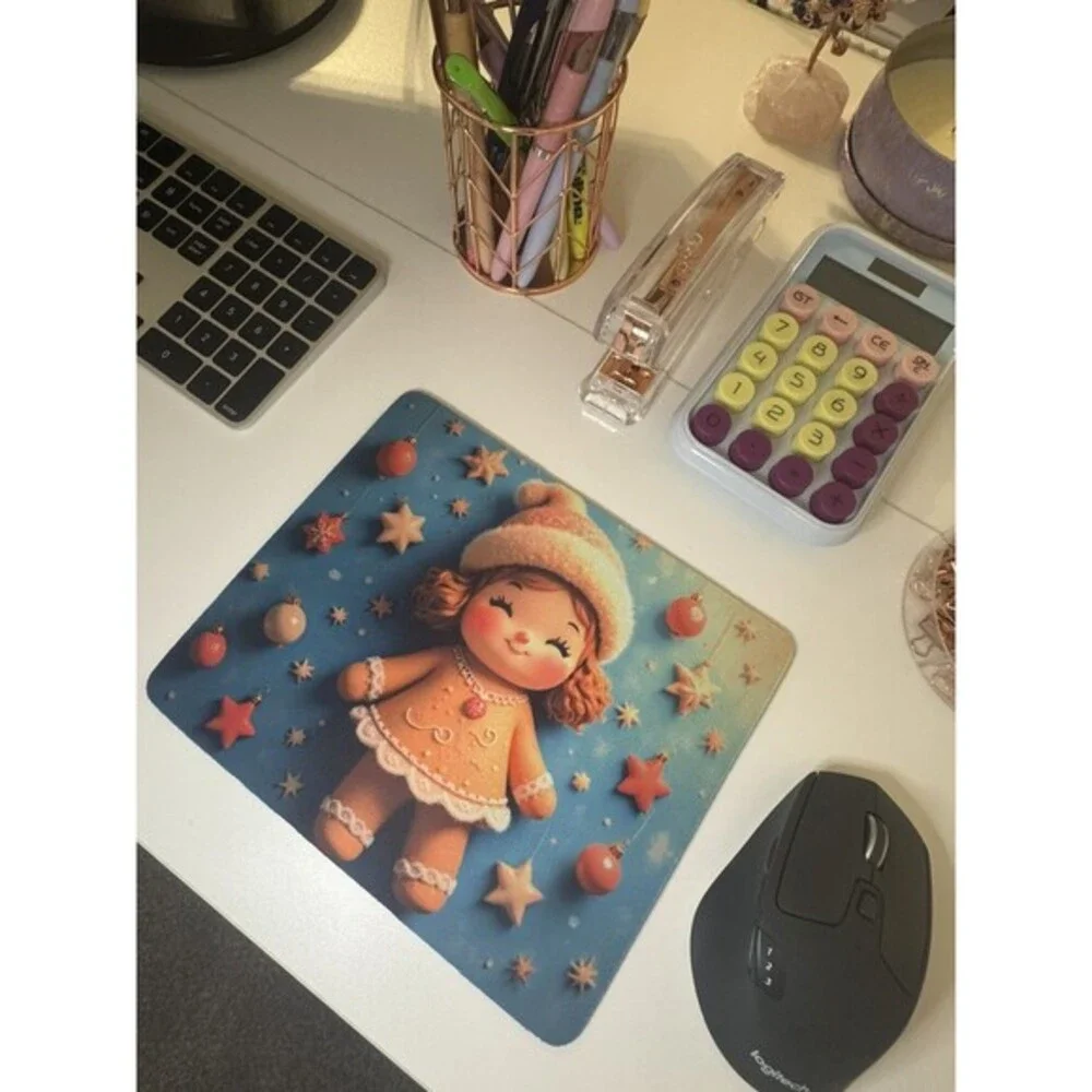 Adorable mouse pad featuring a cute Christmas gingerbread doll design with stars